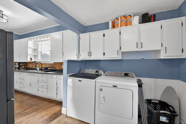 a kitchen with a sink a stove and cabinets