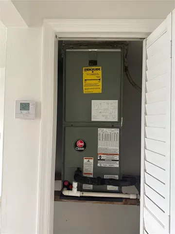 a bathroom with a granite countertop sink and a toilet