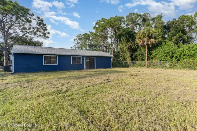 a house with huge green field
