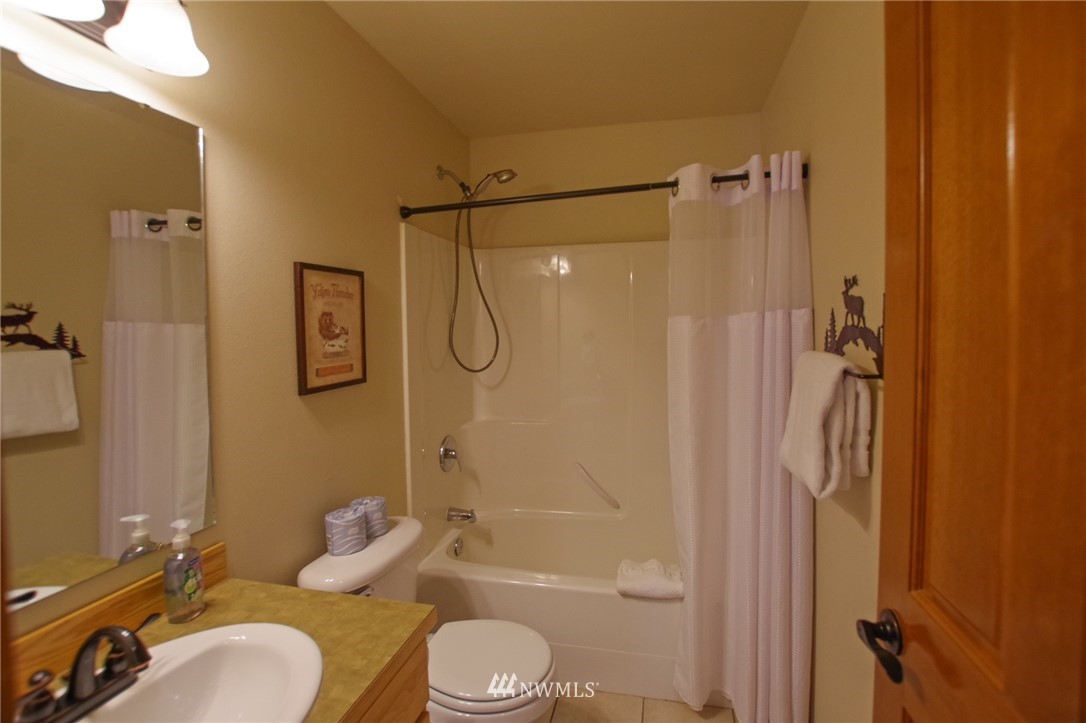 21 Paintbrush Lane Ronald, WA 98940 - Photo 13 of 27 a bathroom with a granite countertop bathtub shower sink vanity and toilet