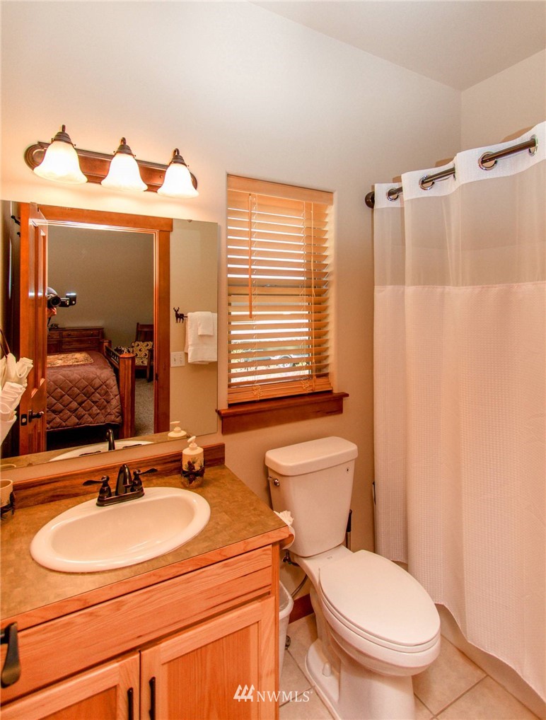 21 Paintbrush Lane Ronald, WA 98940 - Photo 18 of 27 a bathroom with a sink a toilet and a mirror