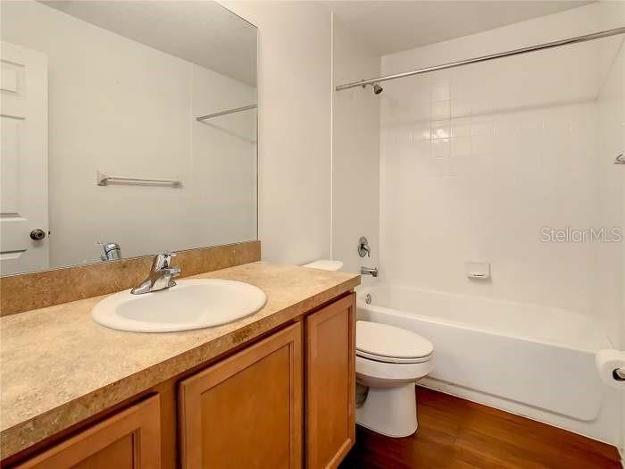 2685 Shelby Ruth Place St. Cloud, FL 34769 - Photo 11 of 16 a bathroom with a sink a toilet and a bathtub