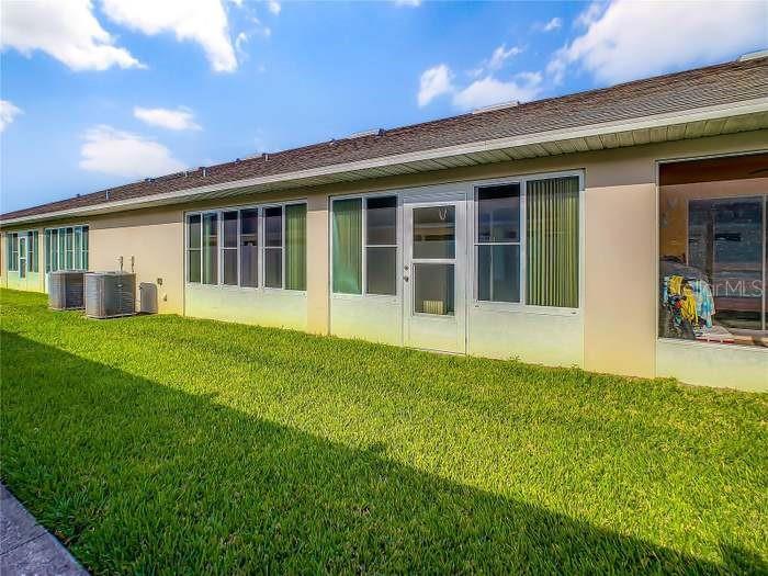2685 Shelby Ruth Place St. Cloud, FL 34769 - Photo 16 of 16 a view of an house with backyard space and balcony