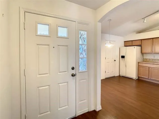 a view of an empty room with a window