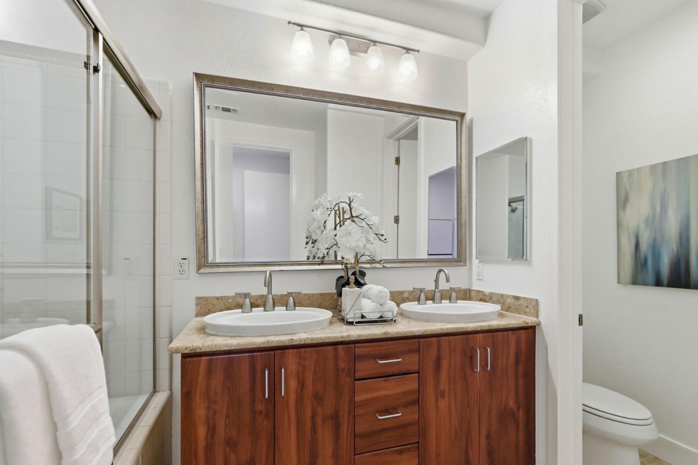 4206 Rickeys Way, Unit C Palo Alto, CA 94306 - Photo 29 of 44 a bathroom with a double vanity sink and a mirror