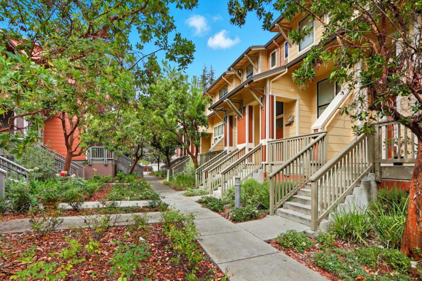 4206 Rickeys Way, Unit C Palo Alto, CA 94306 - Photo 3 of 44 a view of a white house with a yard and plants