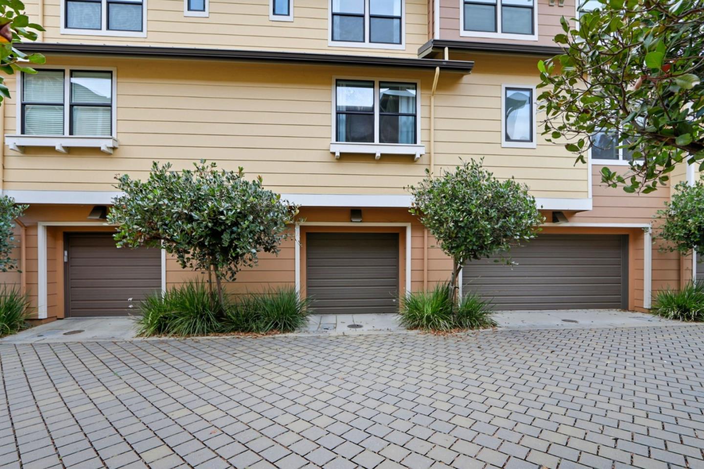 4206 Rickeys Way, Unit C Palo Alto, CA 94306 - Photo 36 of 44 a front view of a house with a yard and a garage