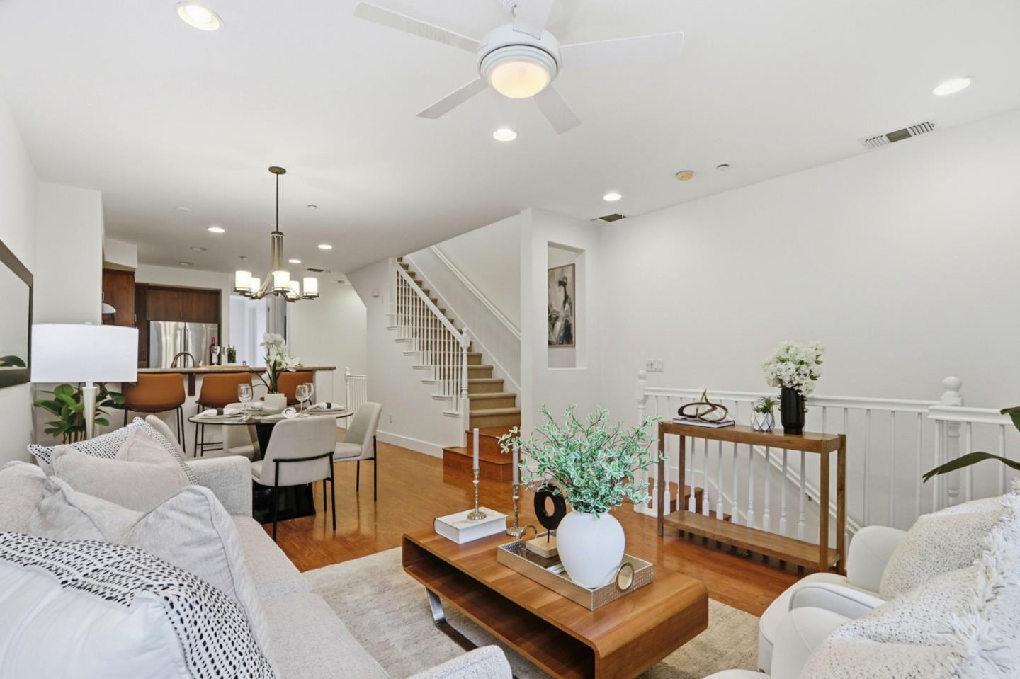 4206 Rickeys Way, Unit C Palo Alto, CA 94306 - Photo 6 of 44 a living room with furniture a chandelier and a dining table