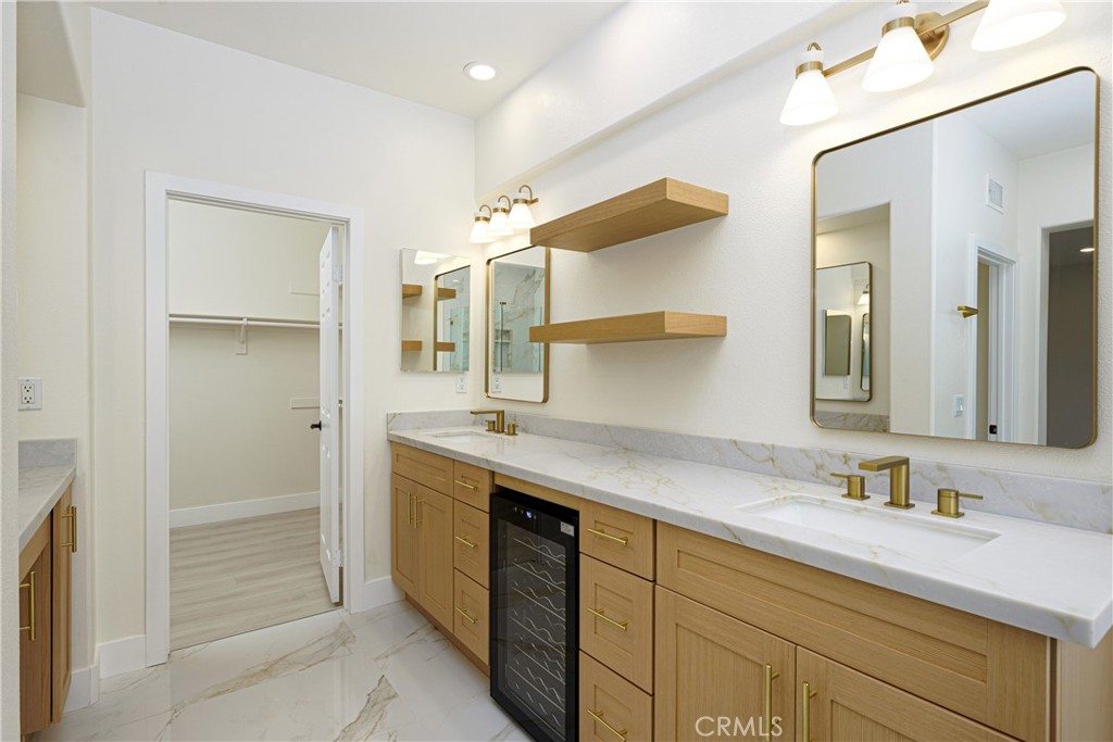 15 Plum Street Ladera Ranch, CA 92694 - Photo 59 of 113 a bathroom with a granite countertop sink mirror and double