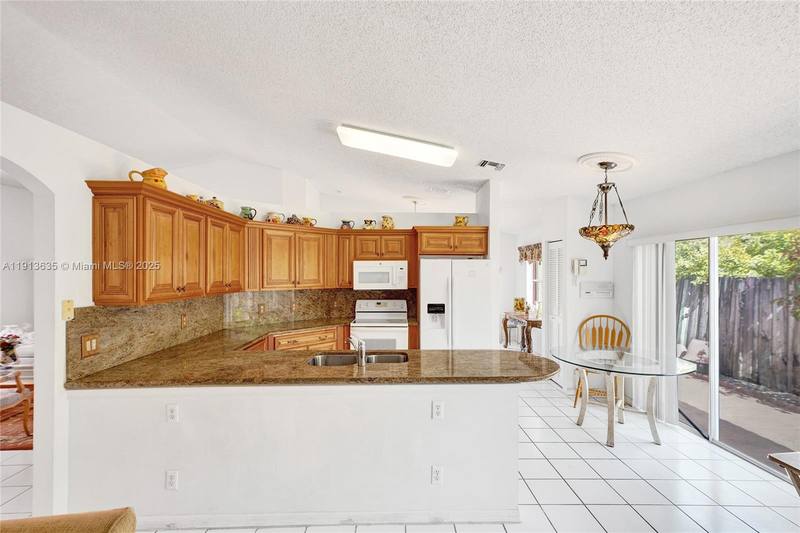 8007 Southwest 157th Place Miami, FL 33193 - Photo 12 of 51 a view of a living room and bathroom