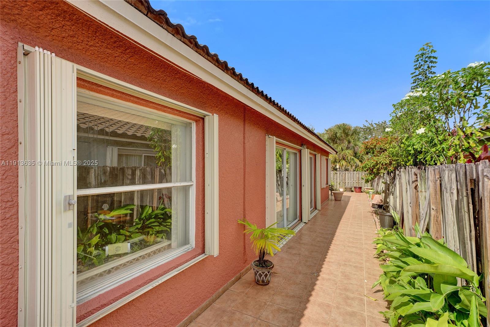 8007 Southwest 157th Place Miami, FL 33193 - Photo 44 of 51 a narrow alley leading to a building