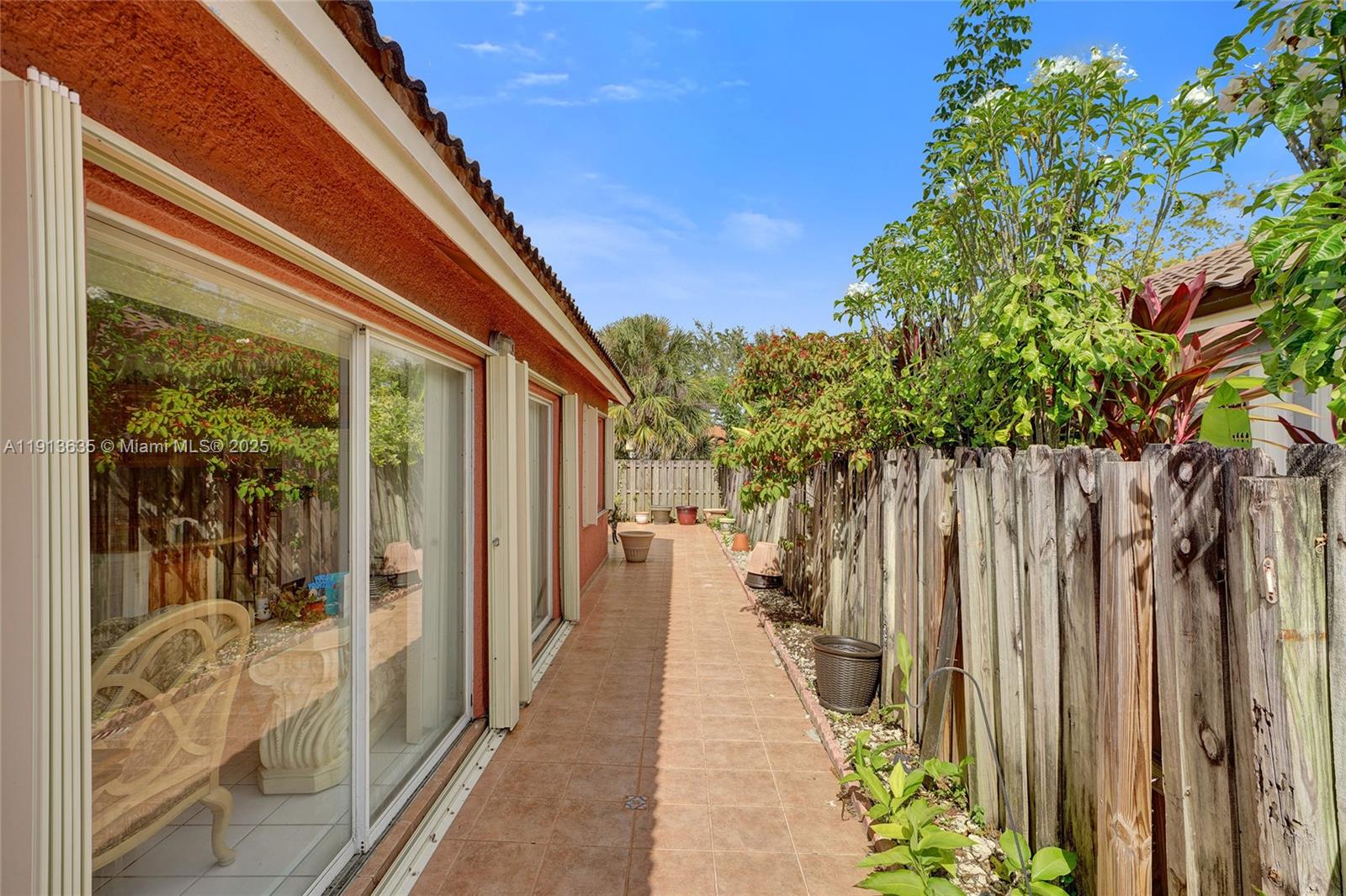 8007 Southwest 157th Place Miami, FL 33193 - Photo 46 of 51 a narrow alley leading to a building