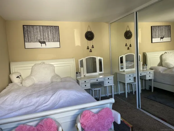 a bedroom with a bed and a table
