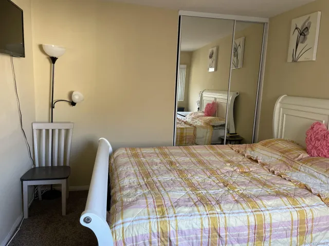 a bedroom with a bed and furniture