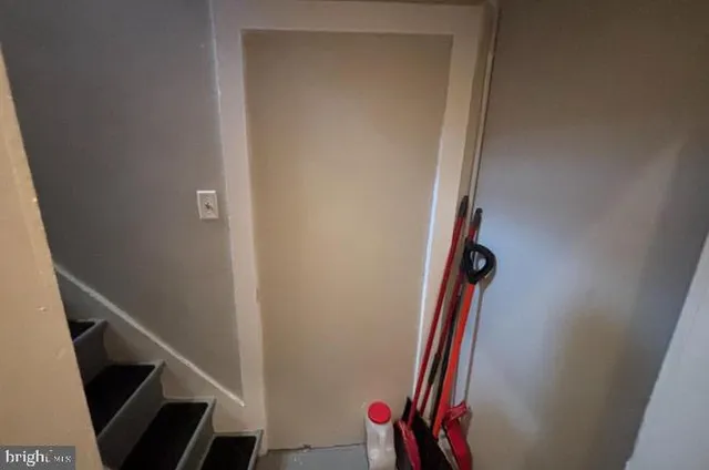 a view of a hallway with stairs