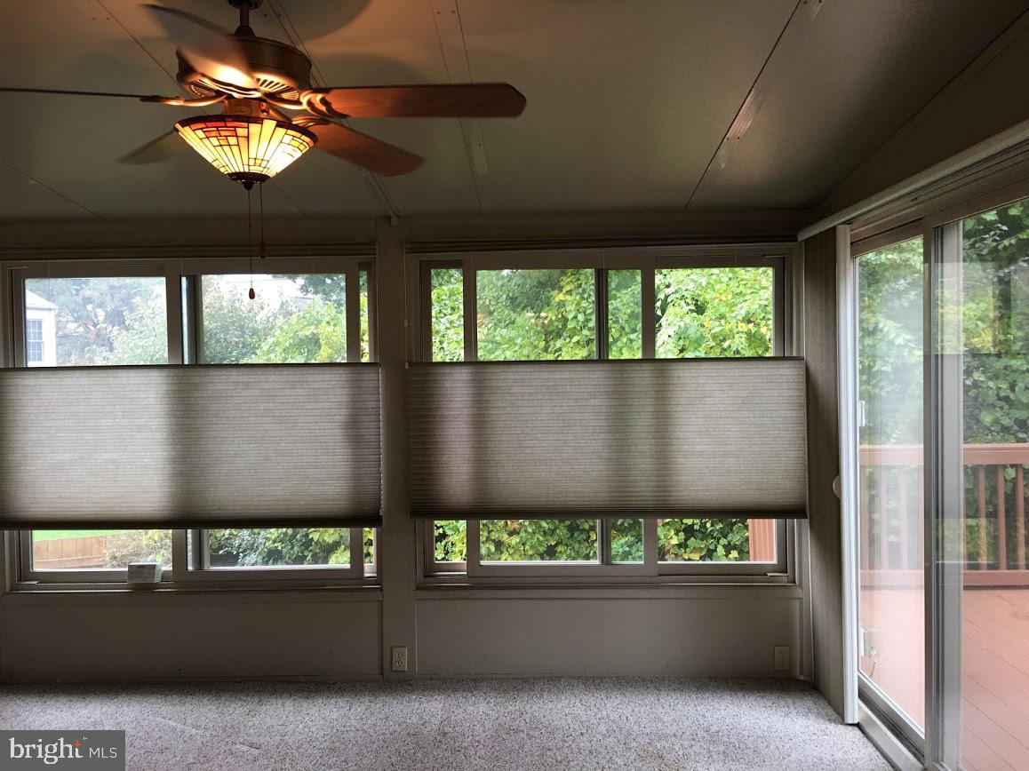 4100 Trentham Drive Baltimore, MD 21208 - Photo 5 of 38 Sun room leading to deck
