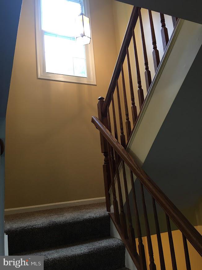 4100 Trentham Drive Baltimore, MD 21208 - Photo 7 of 38 Staircase to upper floor