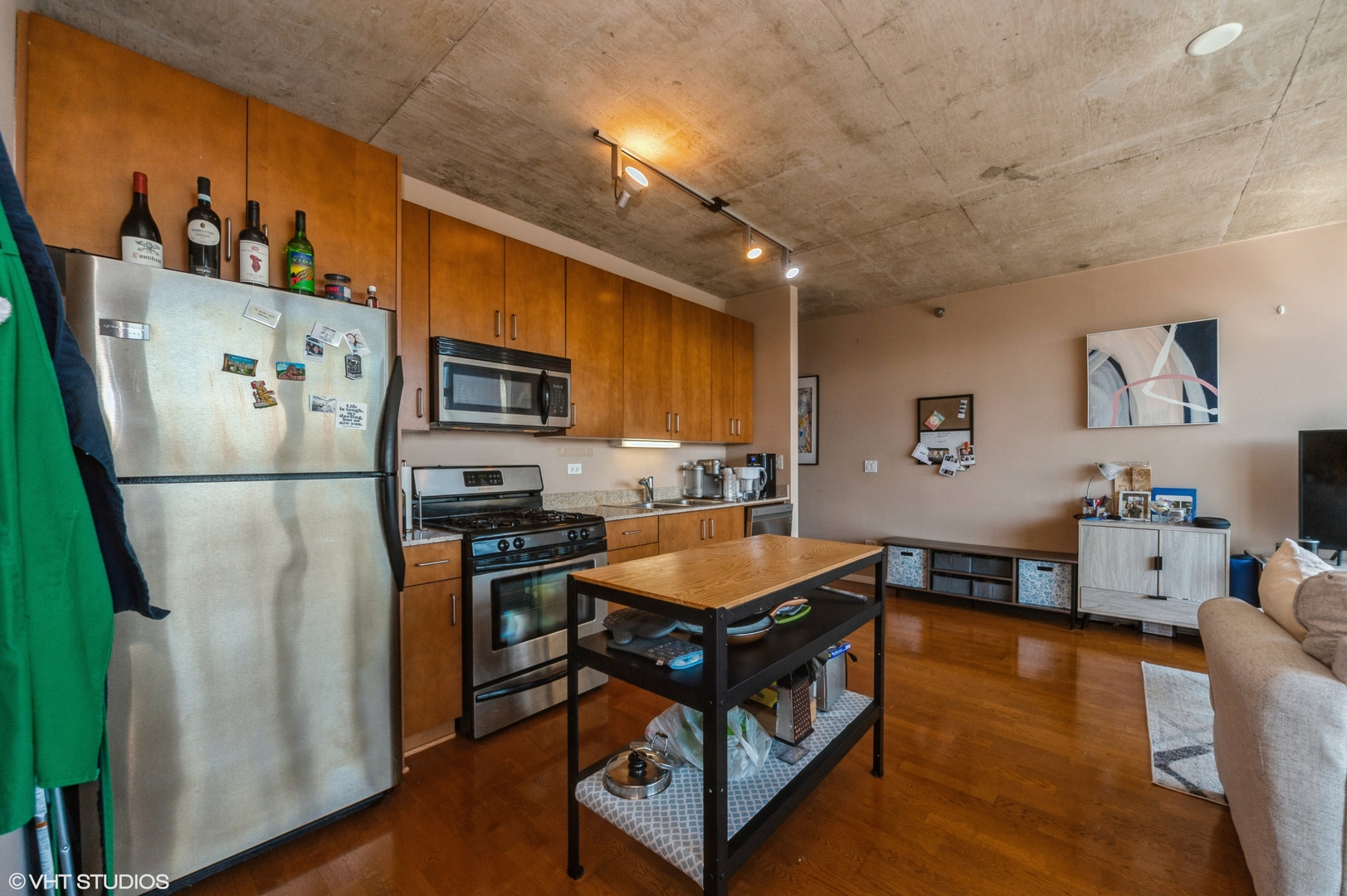 611 South Wells Street, Unit 2602 Chicago, IL 60607 - Photo 8 of 15 a kitchen with stainless steel appliances granite countertop a refrigerator a stove a sink dishwasher and a refrigerator with wooden floor