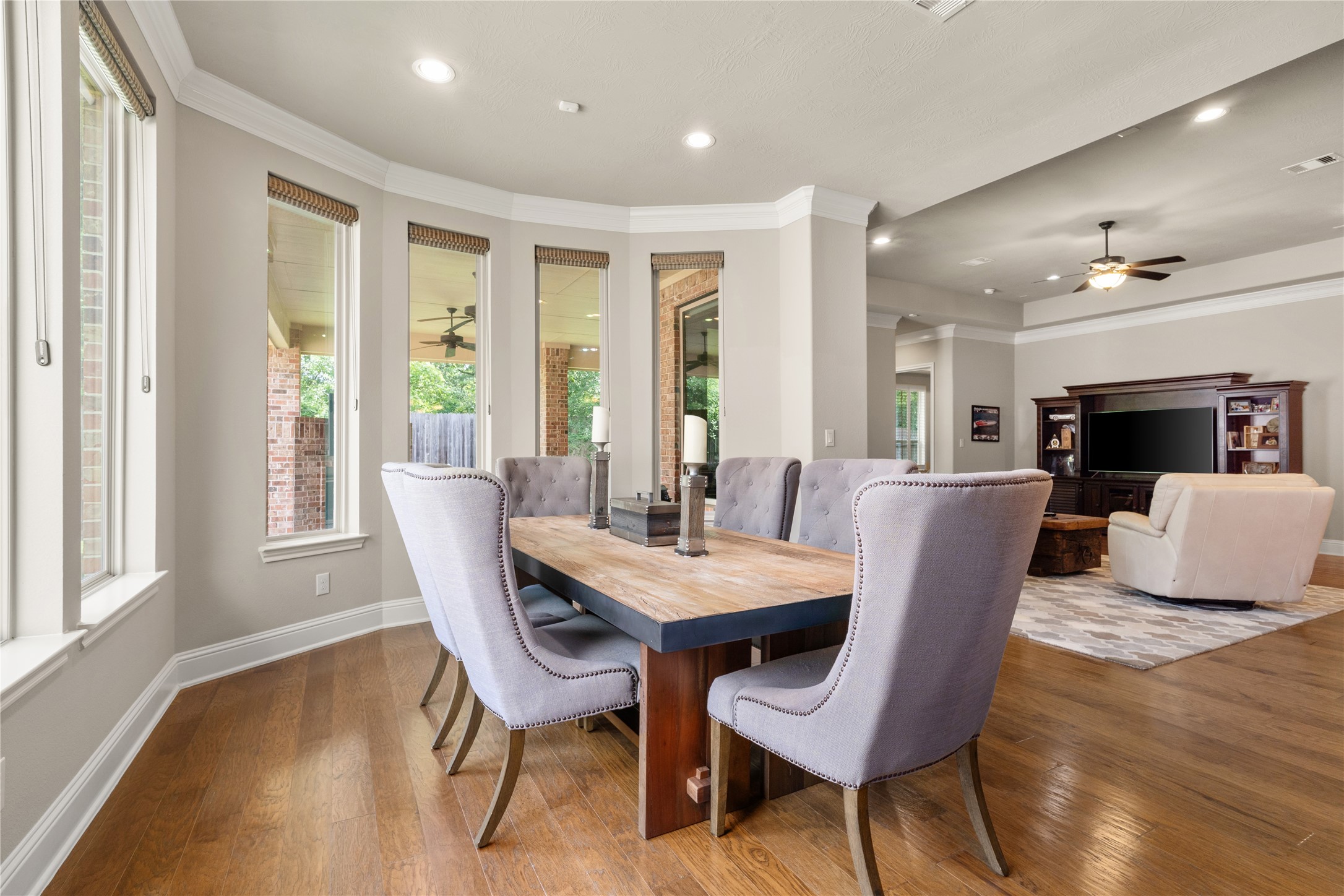 19813 Cullen Ridge Drive Porter, TX 77365 - Photo 15 of 44 You will enjoy the perfect space for gathering around the table in this inviting, light-filled dining area, seamlessly connected to a cozy living room for any occasion.