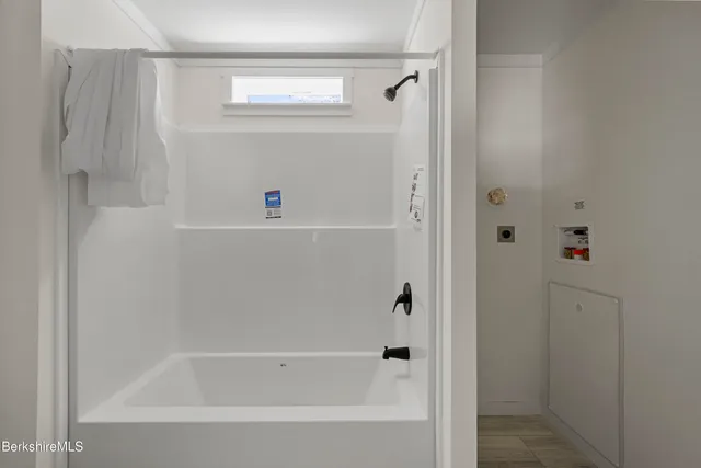 a bathroom with bathtub