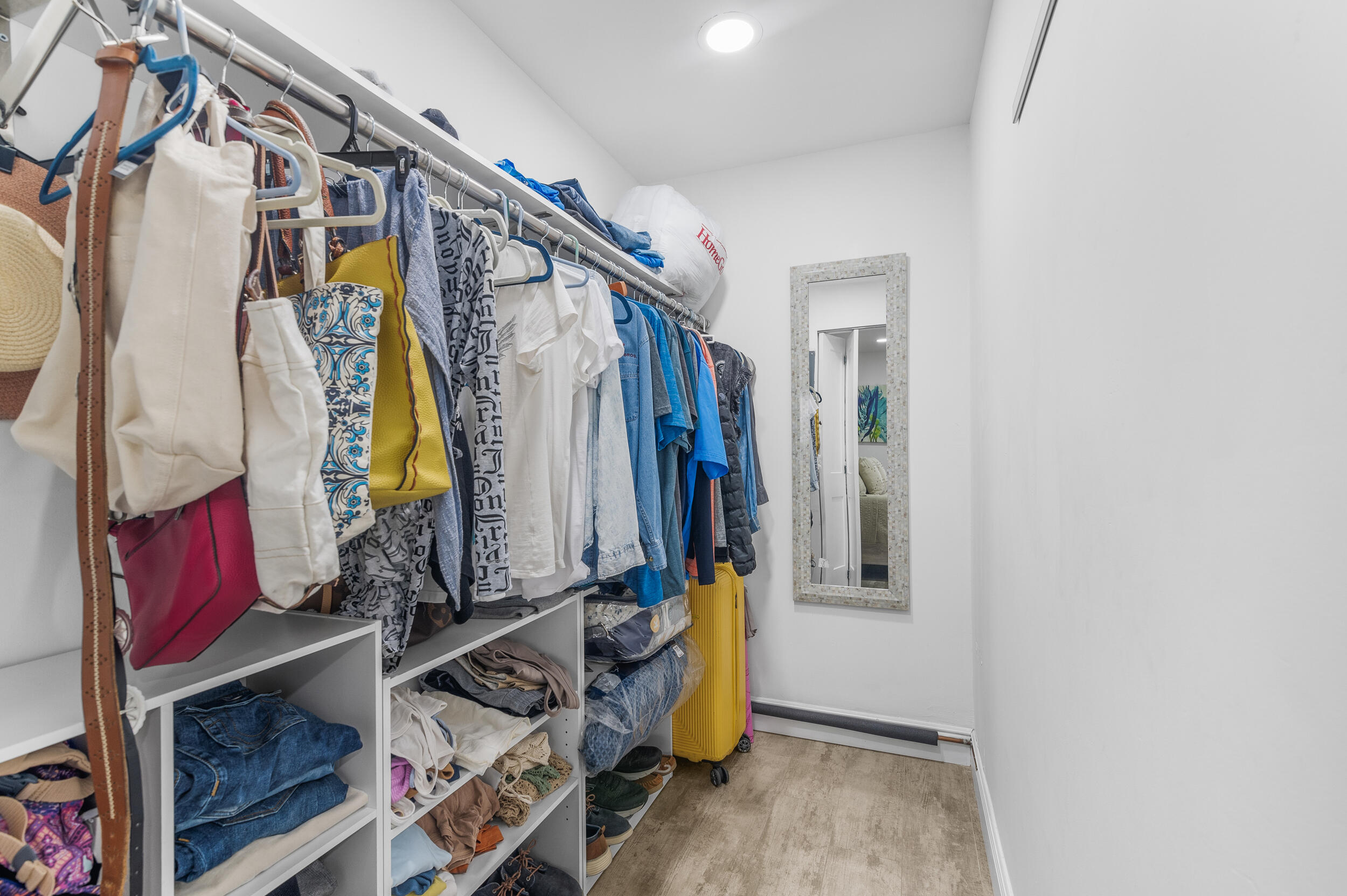 244 Monaco Way Delray Beach, FL 33446 - Photo 24 of 63 a view of walk in closet with clothes