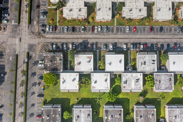 an aerial view of a city and lake view