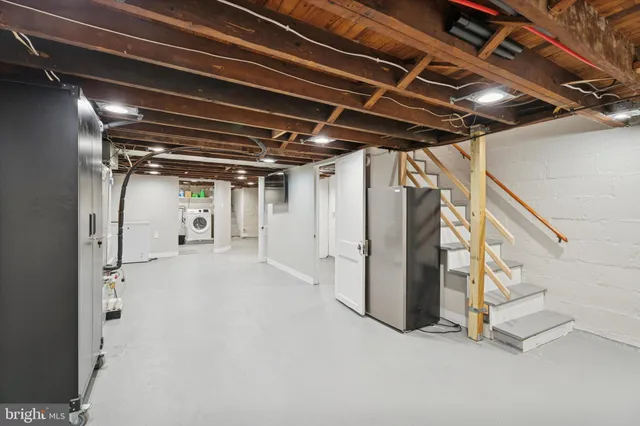 a view of water heater room with stairs