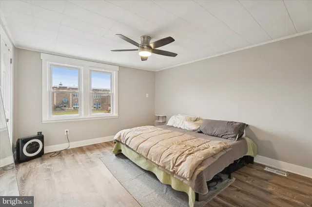 a bedroom with a bed and window