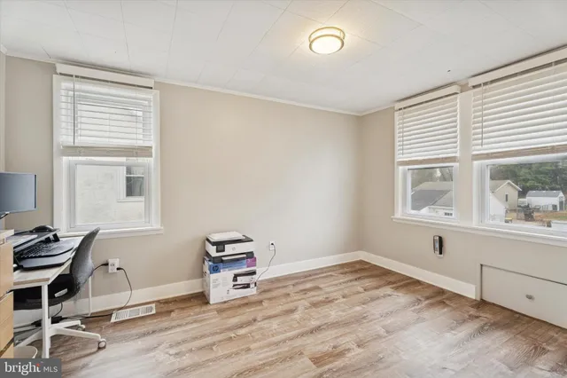 a room with a bed and a window