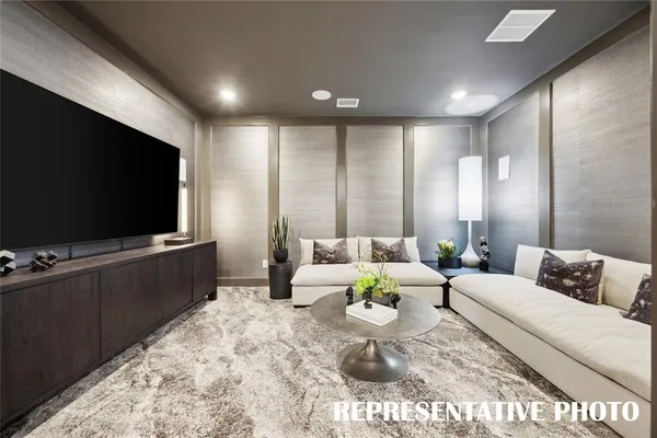 a living room with furniture ceiling fan and a window