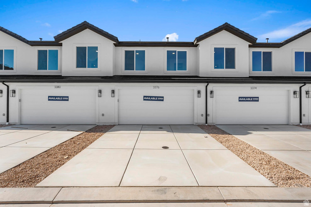 2194 Wolverine Way, Unit 2531 Washington, UT 84780 - Photo 3 of 52 Modern townhome facade featuring white siding and black trim