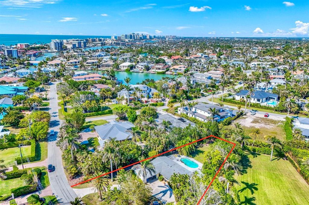 289 Springline Drive Naples, FL 34102 - Photo 4 of 9 an aerial view of residential houses with outdoor space and trees