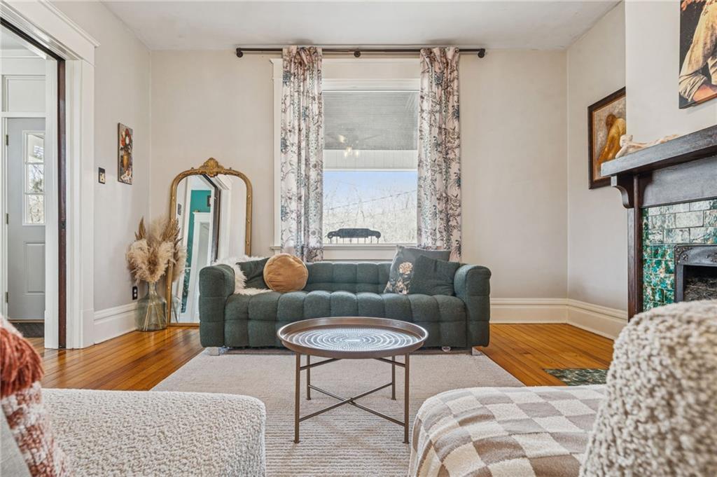 416 Pine Run Road Fombell, PA 16123 - Photo 11 of 50 a living room with furniture and a large window
