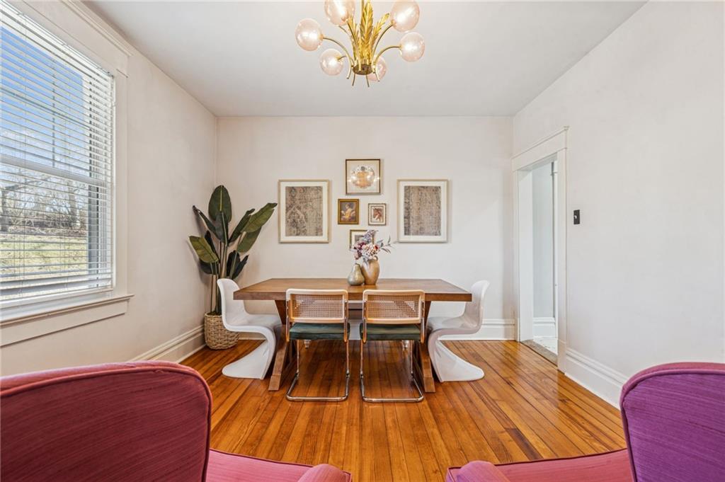 416 Pine Run Road Fombell, PA 16123 - Photo 18 of 50 a view of a dining room with furniture and wooden floor