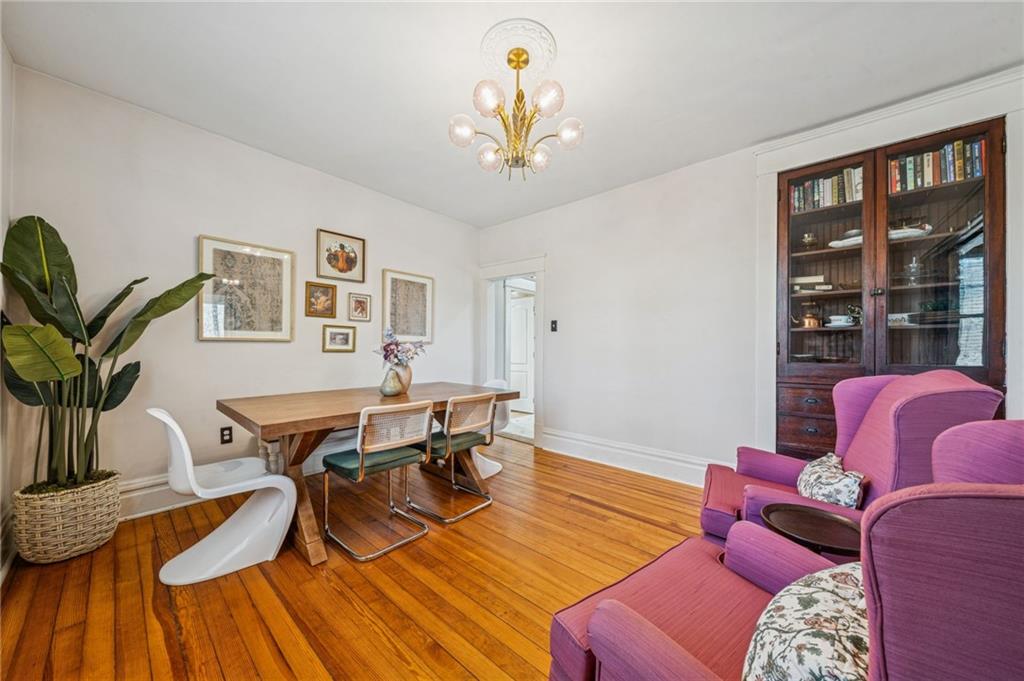 416 Pine Run Road Fombell, PA 16123 - Photo 19 of 50 a workspace with furniture wooden floor and a chandelier