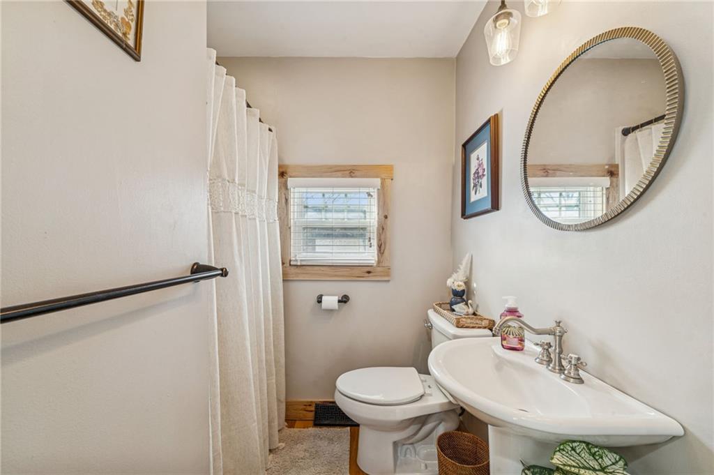 416 Pine Run Road Fombell, PA 16123 - Photo 21 of 50 a bathroom with a sink and a mirror