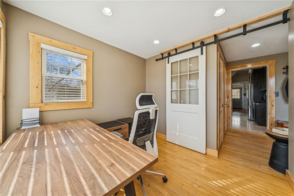 416 Pine Run Road Fombell, PA 16123 - Photo 22 of 50 a bedroom with a bed and wooden floor