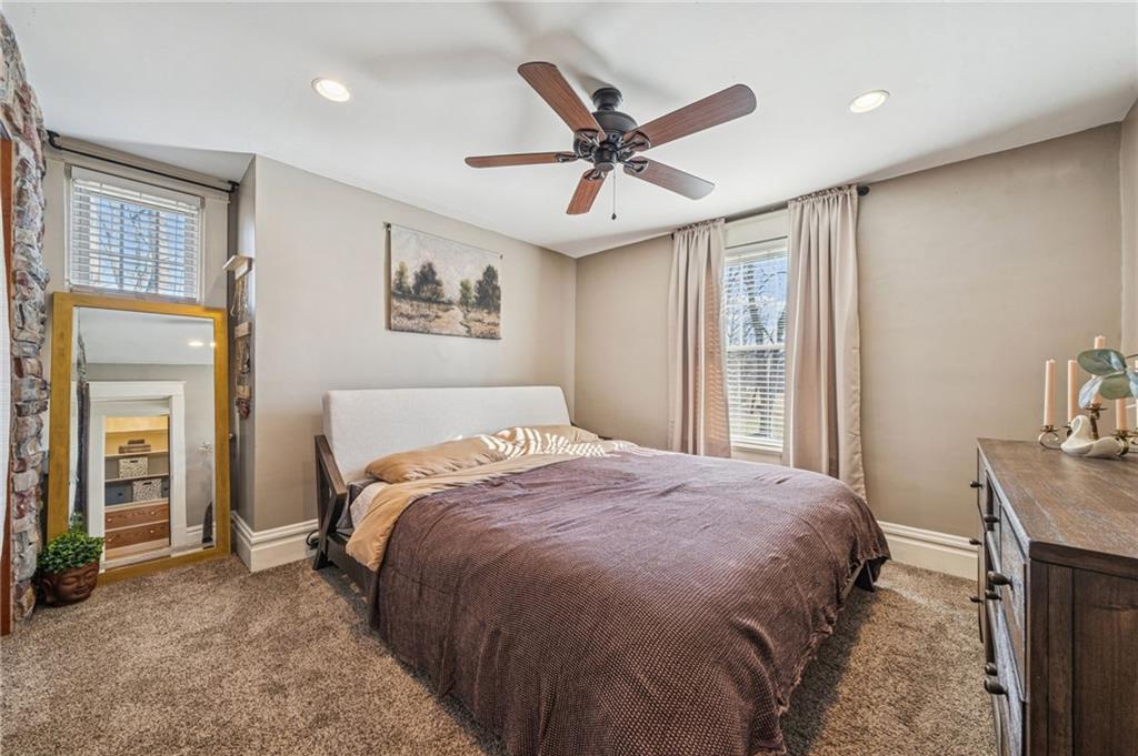 416 Pine Run Road Fombell, PA 16123 - Photo 31 of 50 a bed sitting in a spacious bedroom next to a window