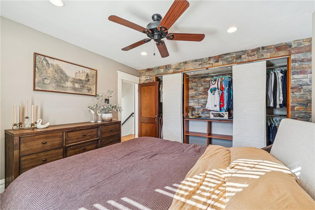 416 Pine Run Road Fombell, PA 16123 - Photo 32 of 50 a bedroom with a bed and a chandelier