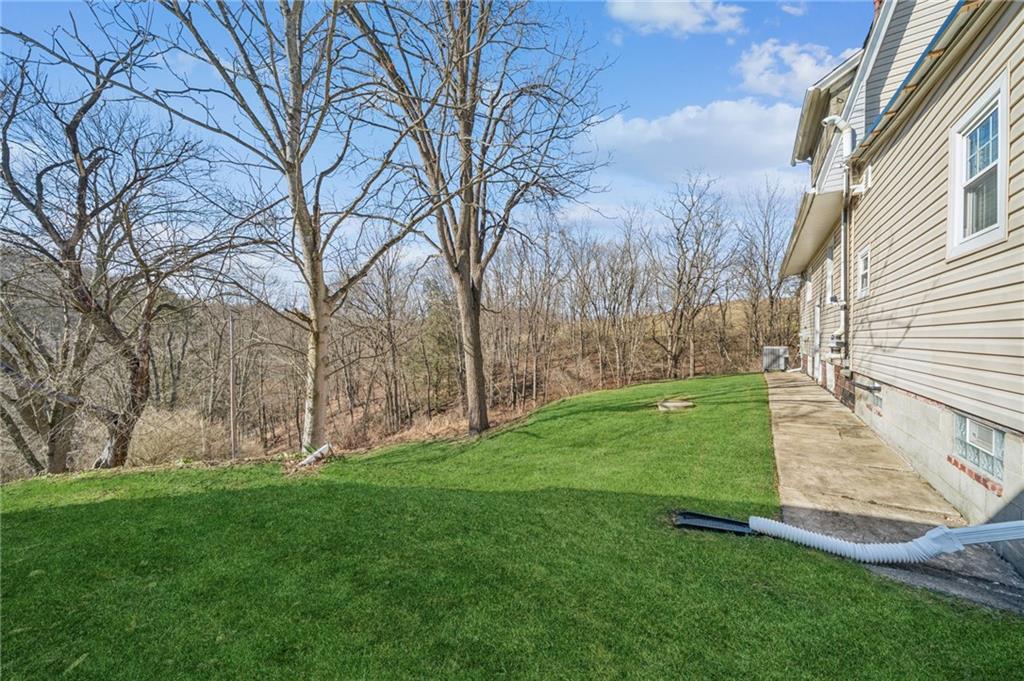 416 Pine Run Road Fombell, PA 16123 - Photo 48 of 50 a view of a backyard with large trees