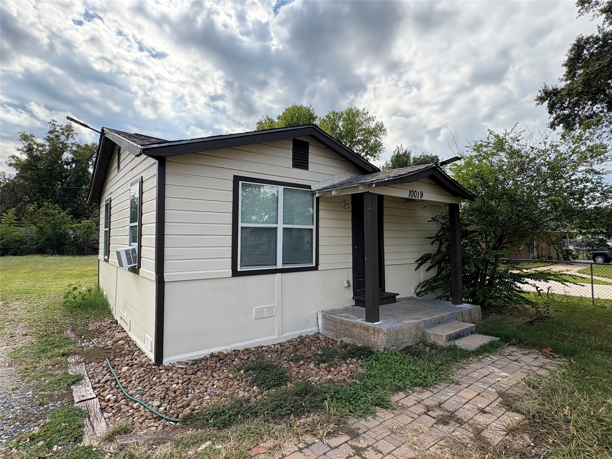 a front view of a house with garden