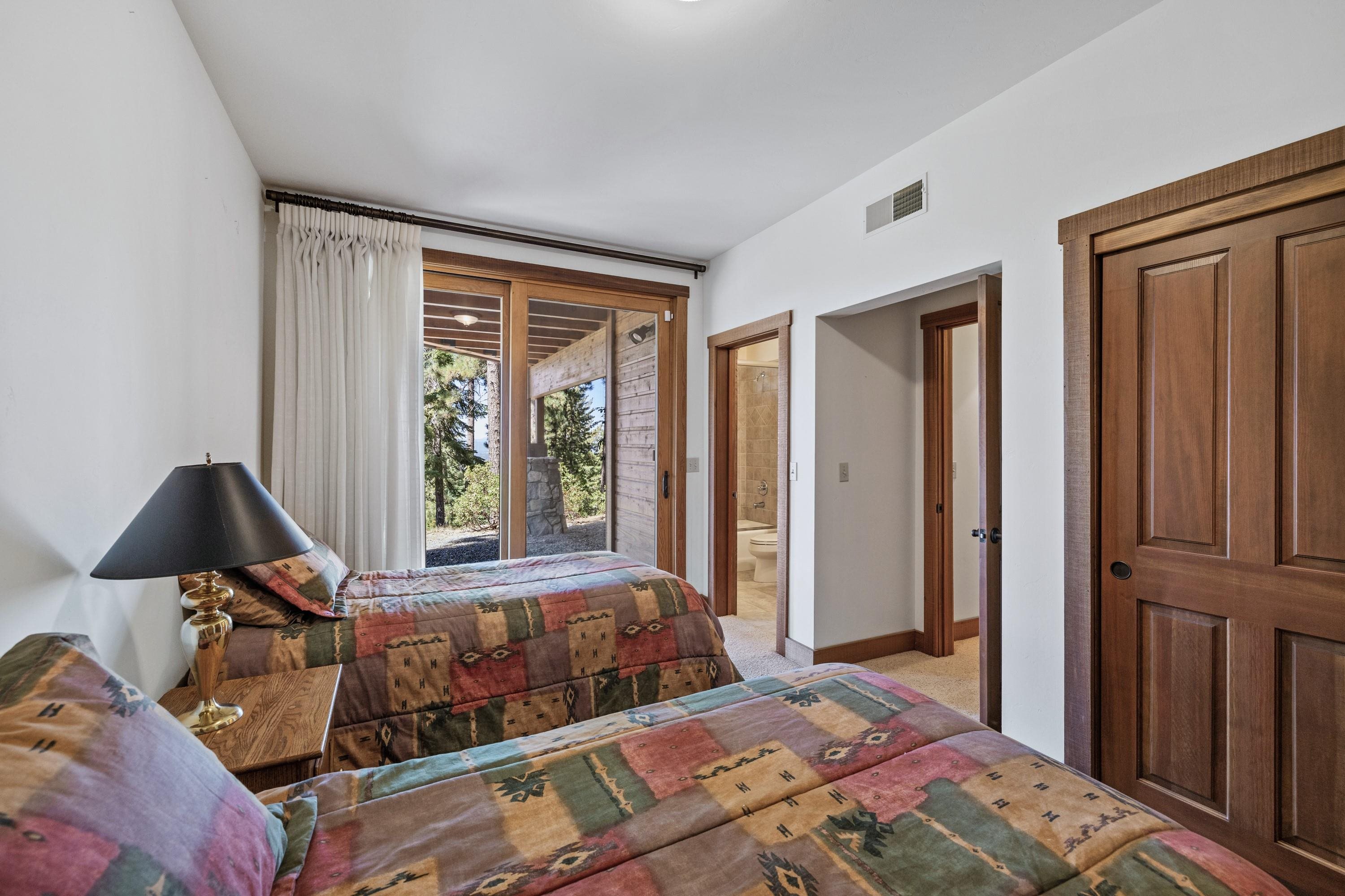 1940 Gray Wolf Truckee, CA 96161 - Photo 18 of 20 a bedroom with a bed and wooden floor