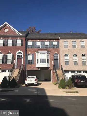 a front view of a house with outdoor space