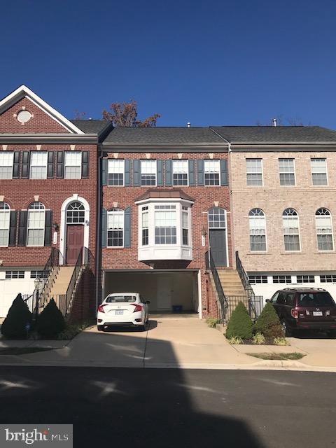 a front view of a house with outdoor space