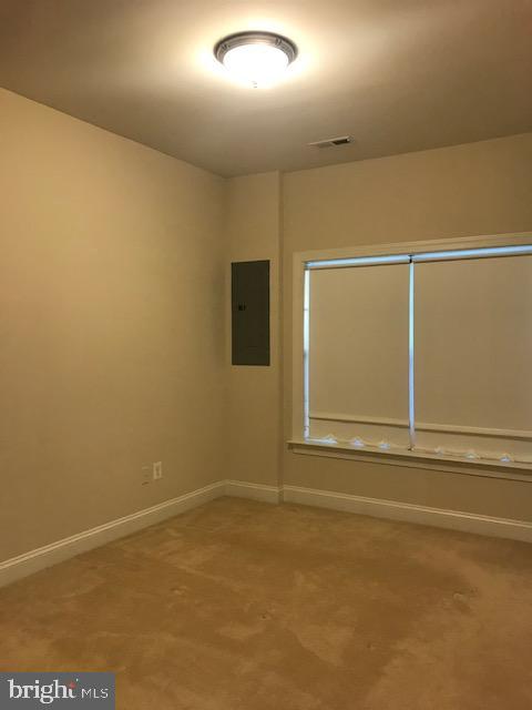 3680 Chippendale Circle Woodbridge, VA 22193 - Photo 11 of 49 a view of an empty room with wooden floor and a window