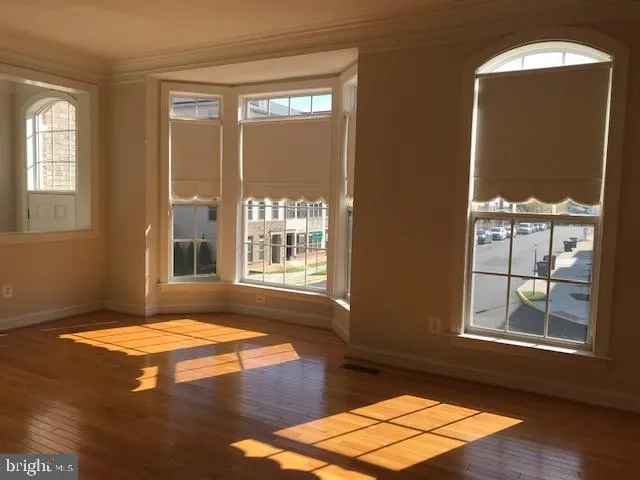 a spacious bedroom with a bed and a window
