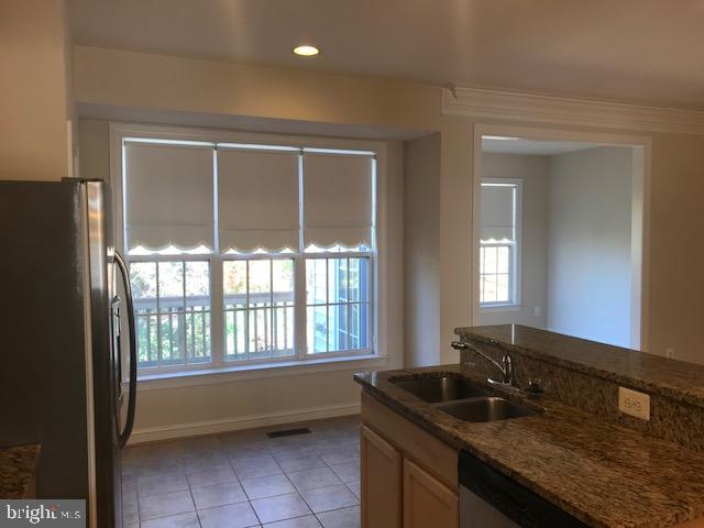 3680 Chippendale Circle Woodbridge, VA 22193 - Photo 25 of 49 a kitchen with a sink and large windows