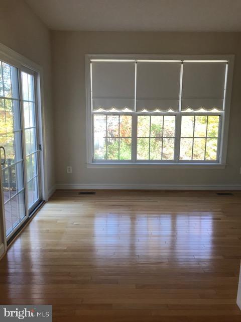 3680 Chippendale Circle Woodbridge, VA 22193 - Photo 28 of 49 an empty room with wooden floor and windows