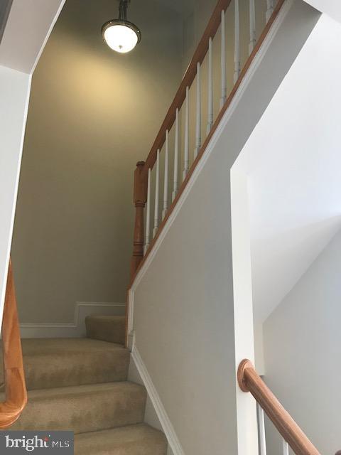 3680 Chippendale Circle Woodbridge, VA 22193 - Photo 32 of 49 a view of staircase with white walls and a window