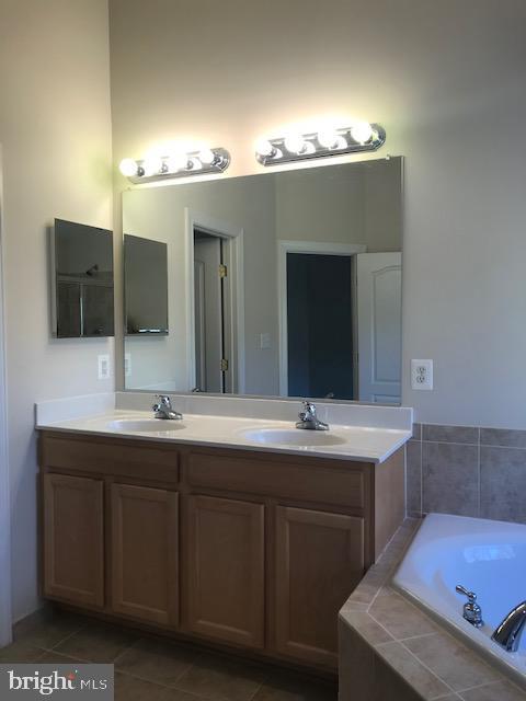3680 Chippendale Circle Woodbridge, VA 22193 - Photo 49 of 49 a bathroom with a double vanity sink and a mirror